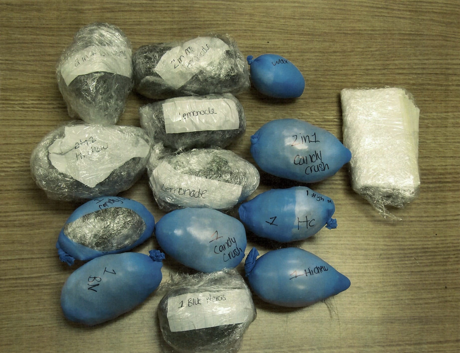 Balloons and wrapped packages of narcotics seized after the Marcy drone drop.