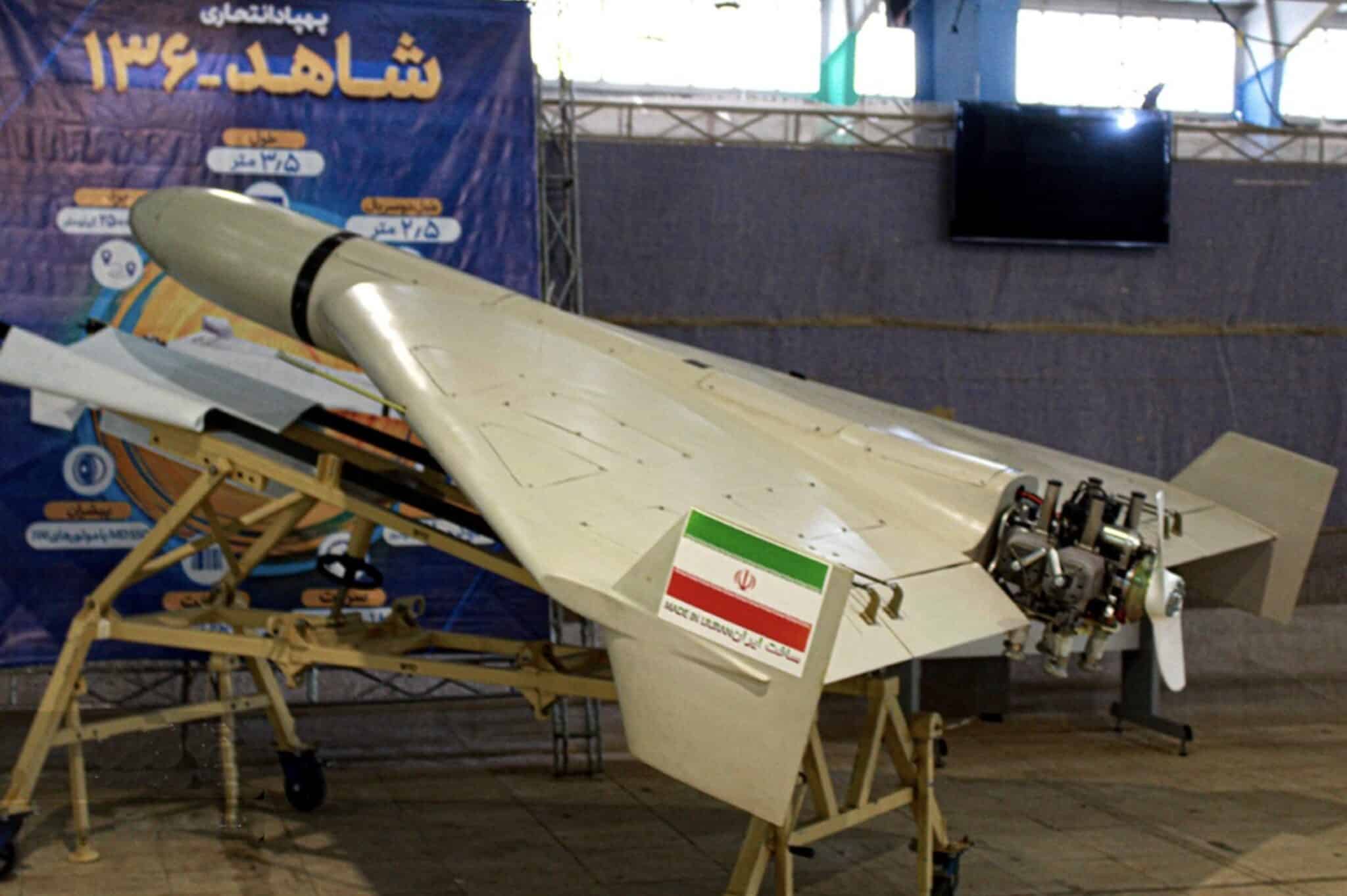 Iranian Shahed-136 delta-wing loitering munition displayed on a stand at an exhibition.