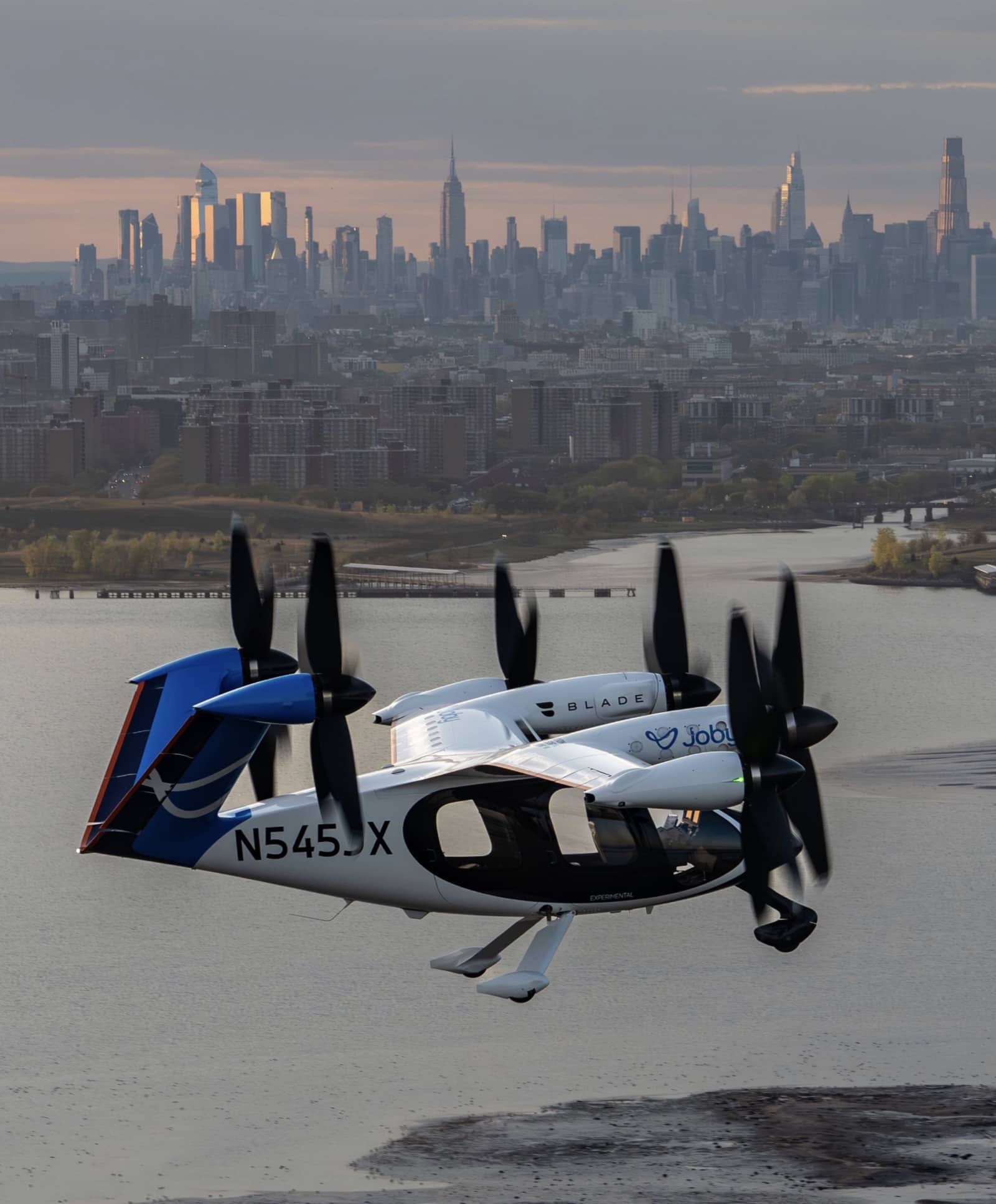 The Joby aircraft crossing the Manhattan skyline during the demonstration campaign.