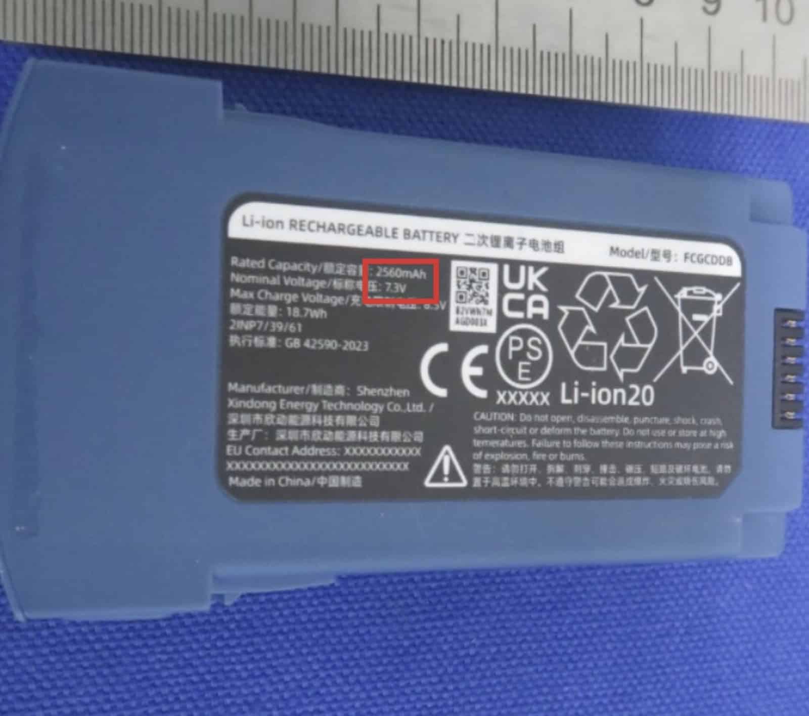 Battery label reading 2,560 mAh and 7.3 volts, manufactured in Shenzhen.