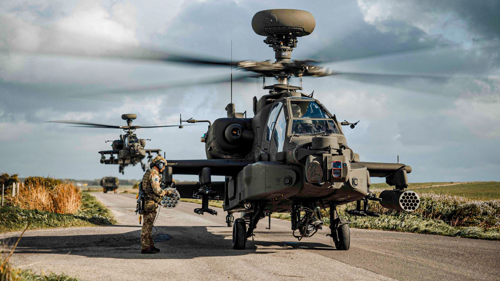 A British Army AH-64E Apache attack helicopter, the platform Project NYX drones would escort.