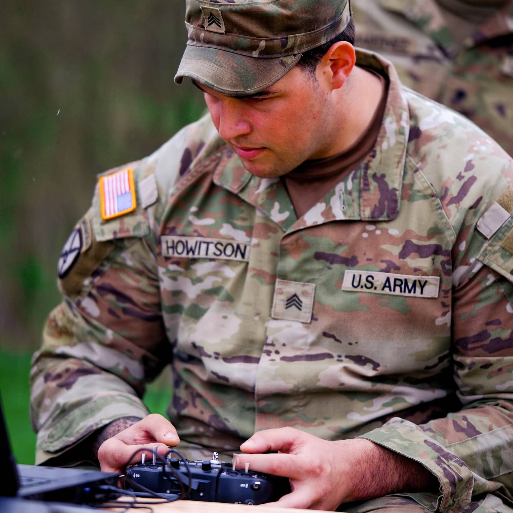 A soldier flying the Bumblebee V1 through an FPV headset during counter-drone training.