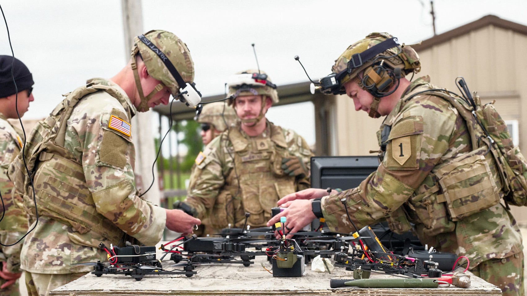 Argus Industrial representatives discussing the strike drone concept with 1st Infantry Division soldiers.