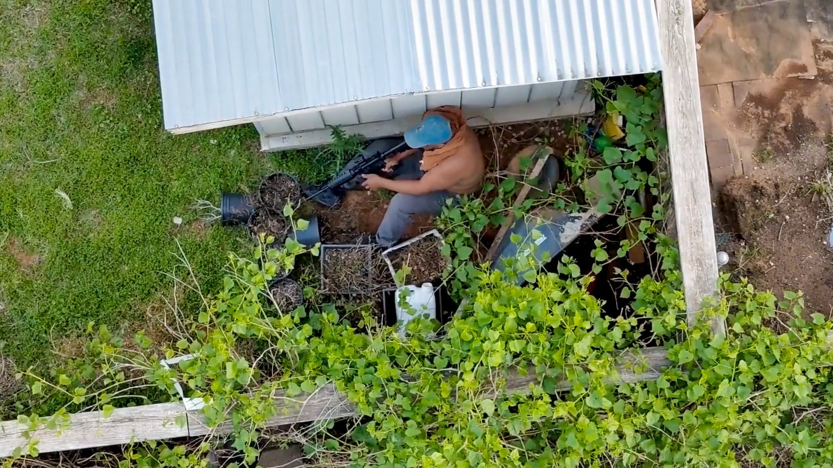 Skydio X10 view of the backyard where the armed suspect hid behind a shed.