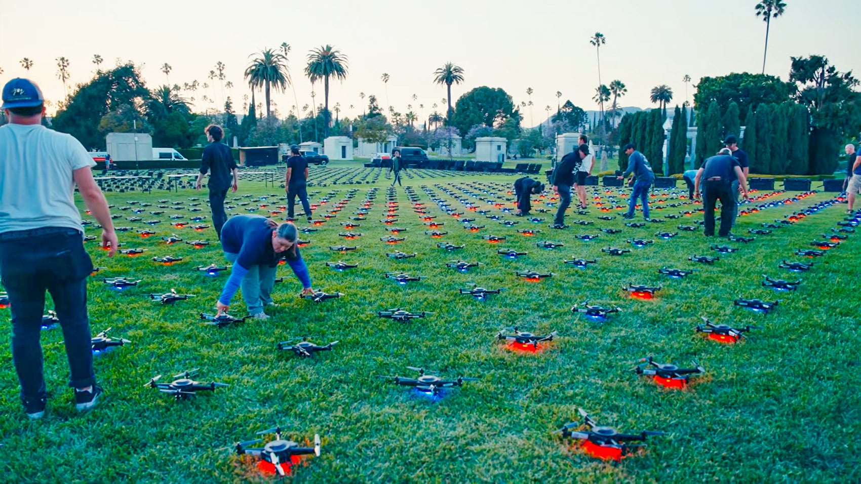 Drone formation lighting the night sky above Hollywood Forever Cemetery in Los Angeles.