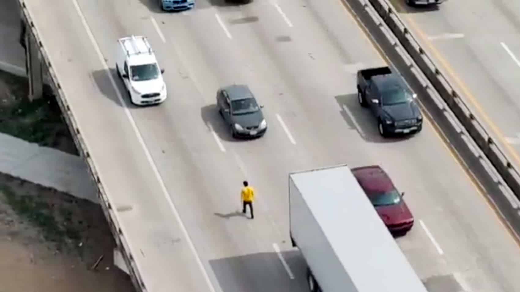 Dallas PD drone view of the man walking into northbound I-45 traffic lanes.
