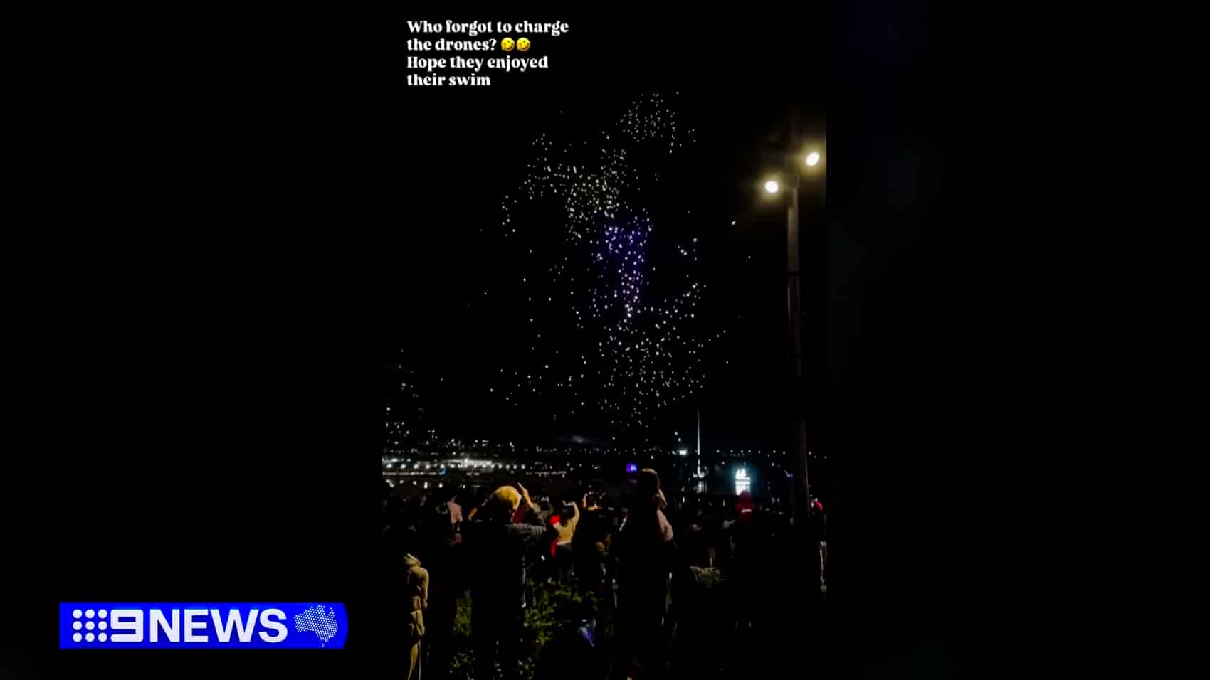 Light-show drones scattered out of formation above the Sydney waterfront.