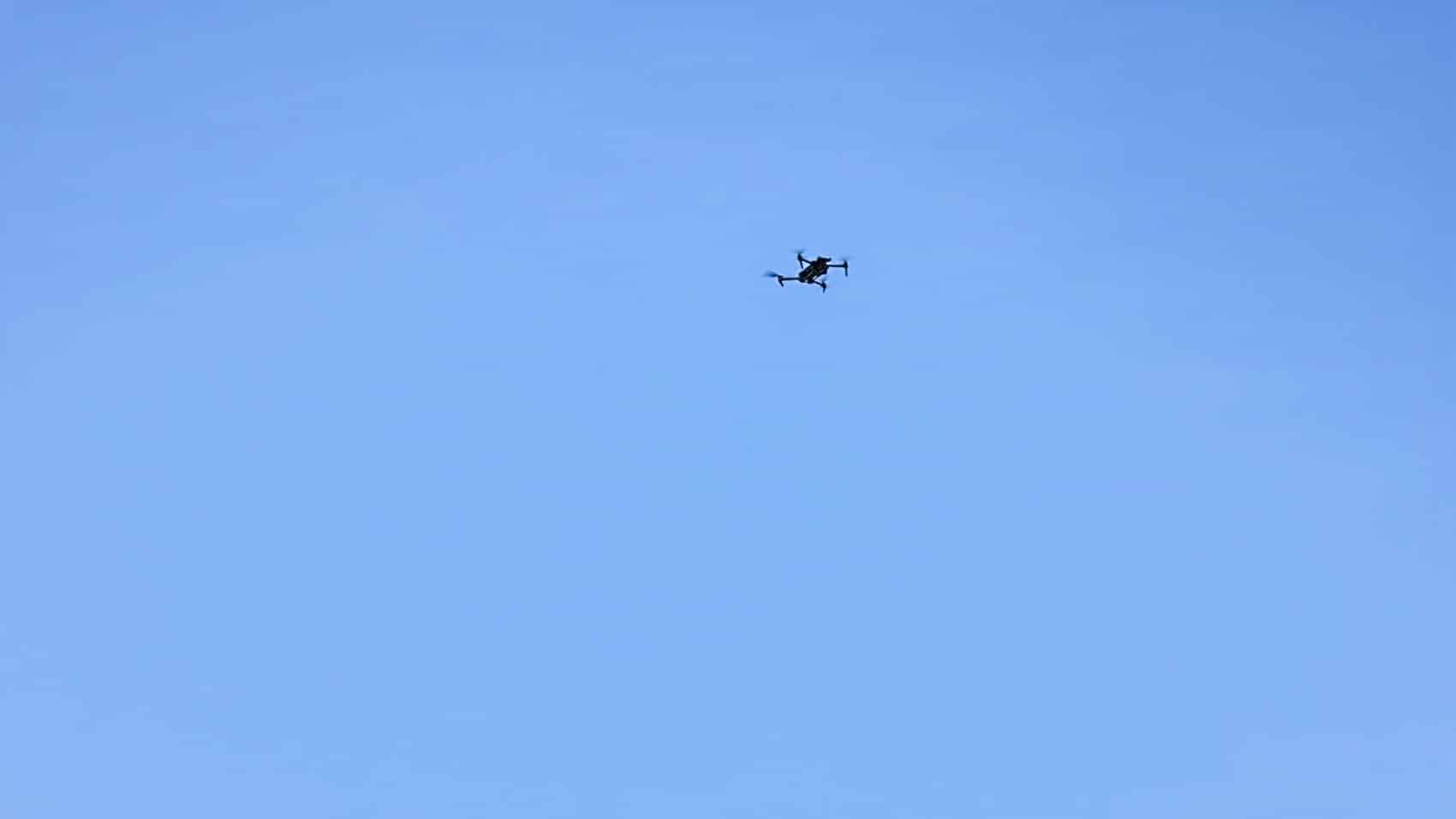 Guard and British Army personnel working a combined arms problem with live drone video.