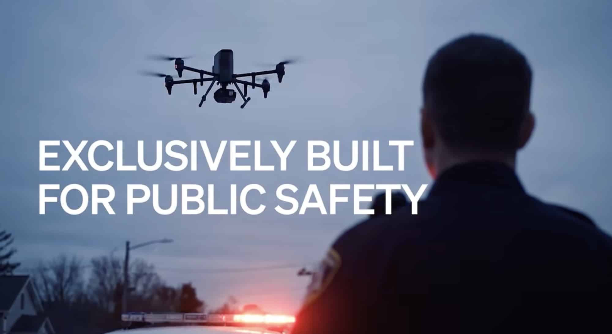 Flock marketing frame reading exclusively built for public safety behind a silhouetted officer.