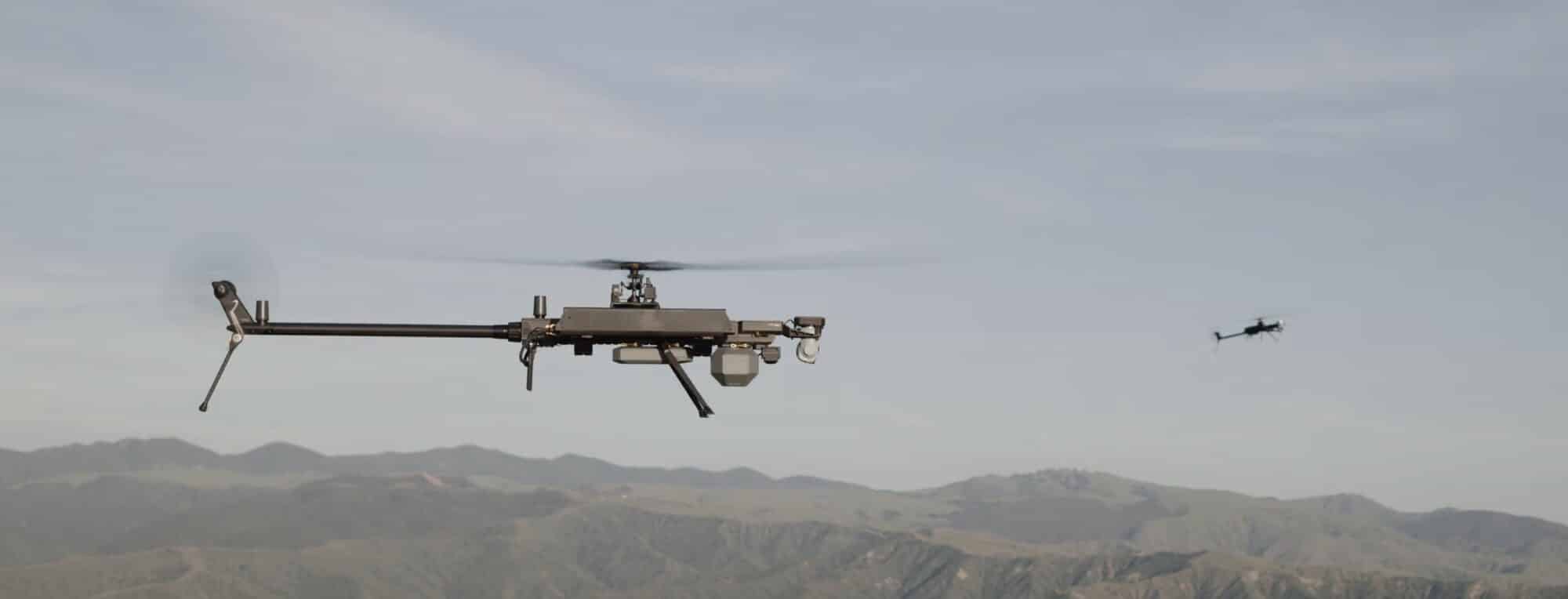 Anduril munition in flight over a mountain range with a second aircraft behind.