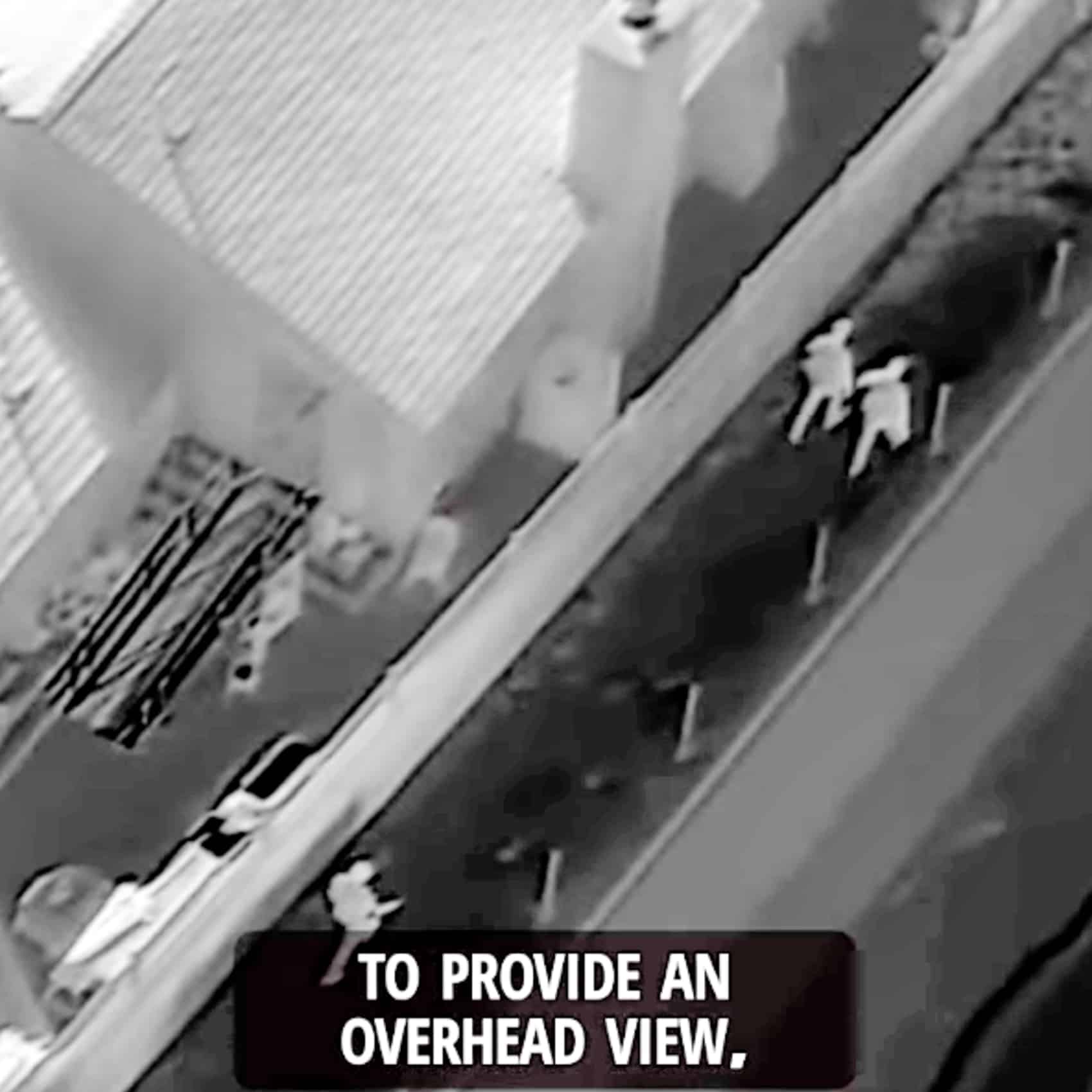 Thermal imagery paints the hiding suspect as a bright shape inside a wooden storage shed.
