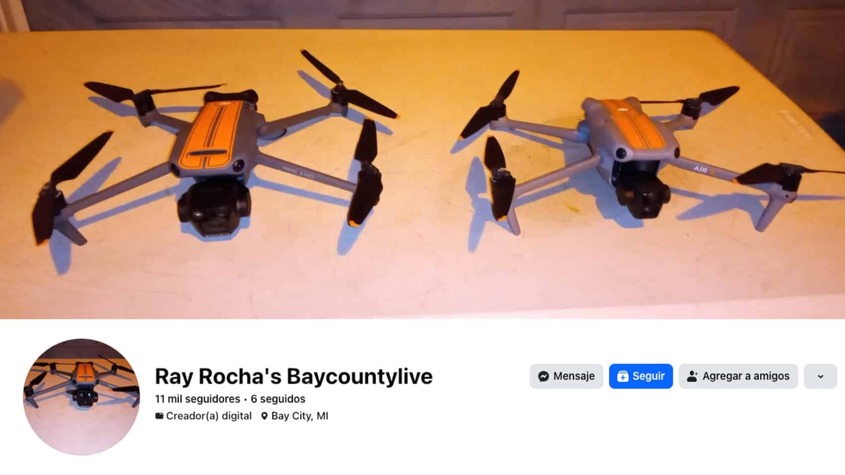 Two orange Autel drones on a table above a creator's Facebook profile card.