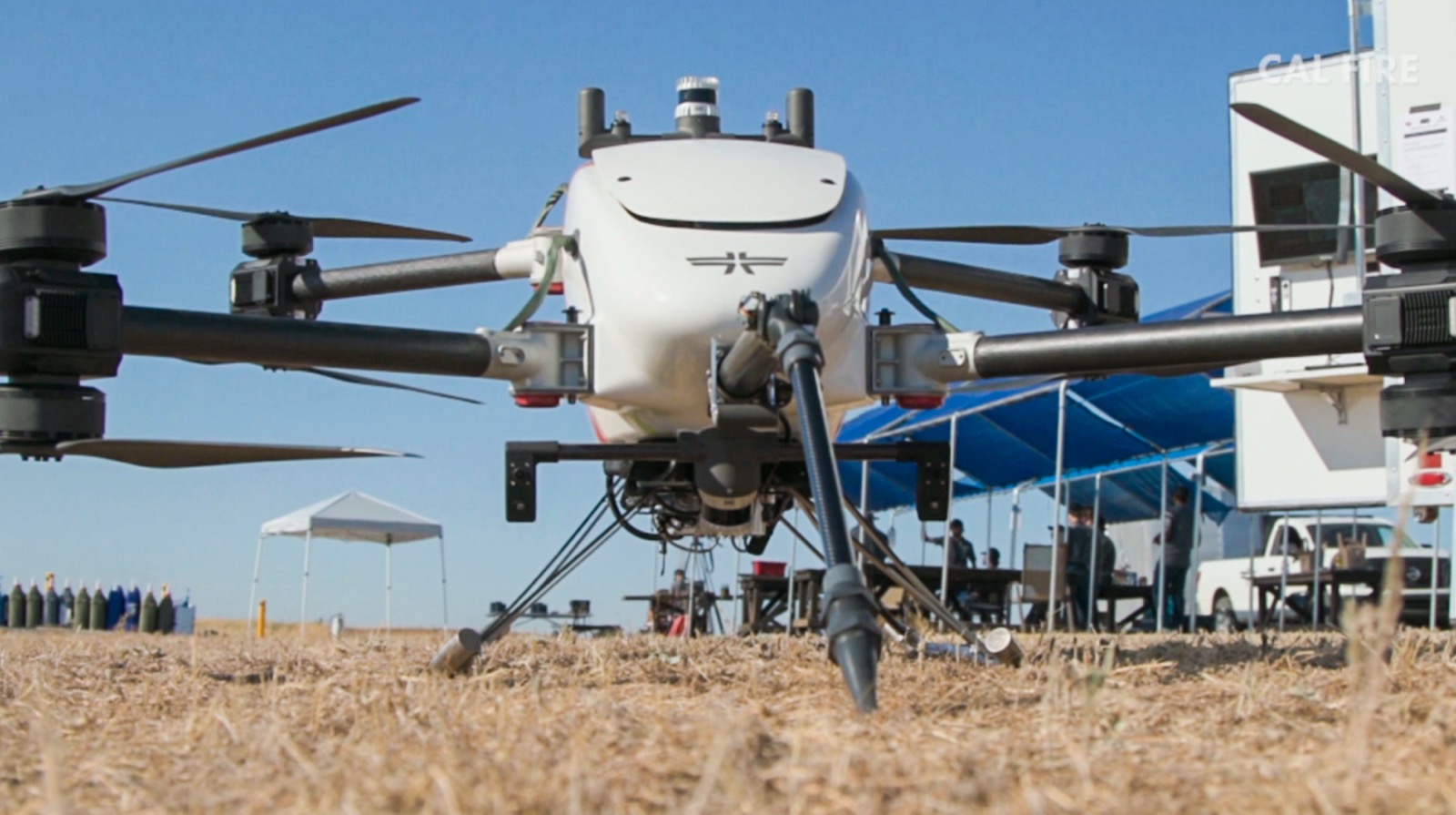 Cal Fire and FireWERX personnel watch a Seneca drone field test in California