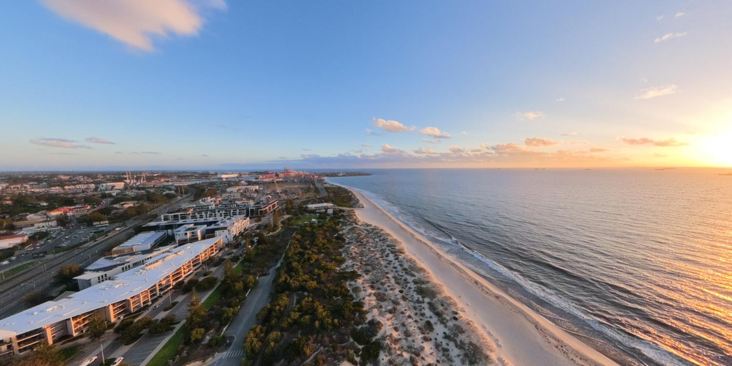 Aerial sunset view of coastline captured by DJI Avata 360
