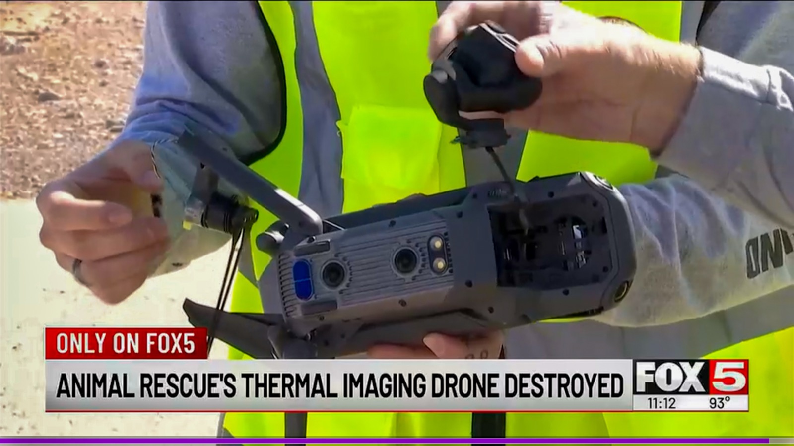 Paws Patrol LV volunteer holding the damaged thermal rescue drone