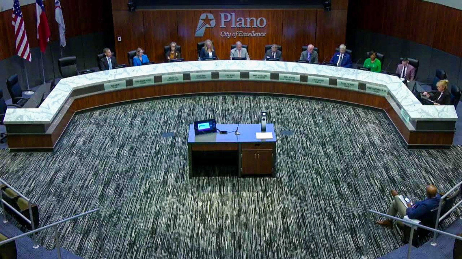 Plano City Council seated in its chamber during a public meeting