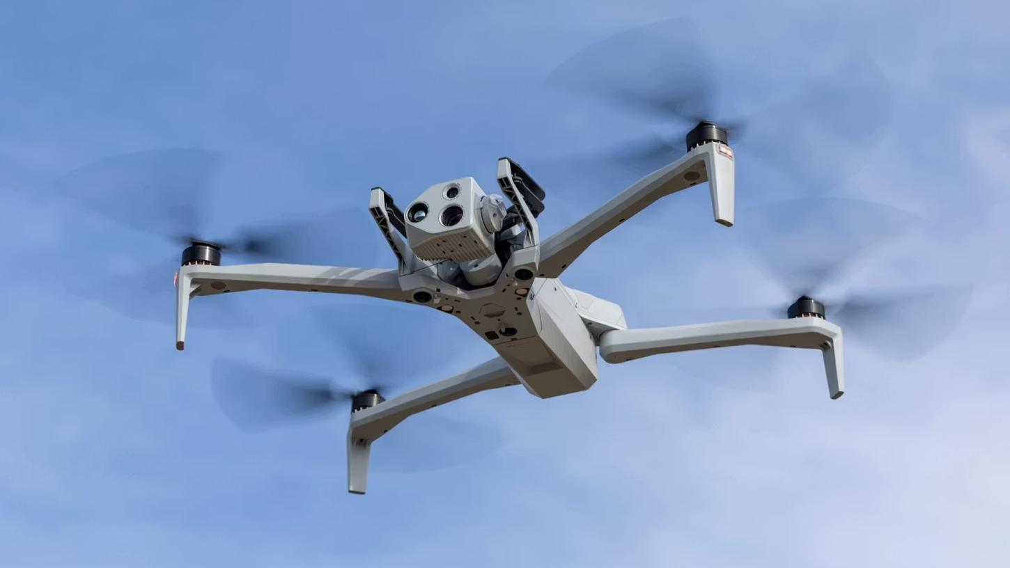 Skydio X10 drone in flight against a blue sky