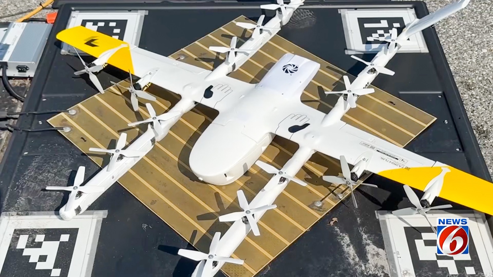 Wing delivery drone parked on its launch pad