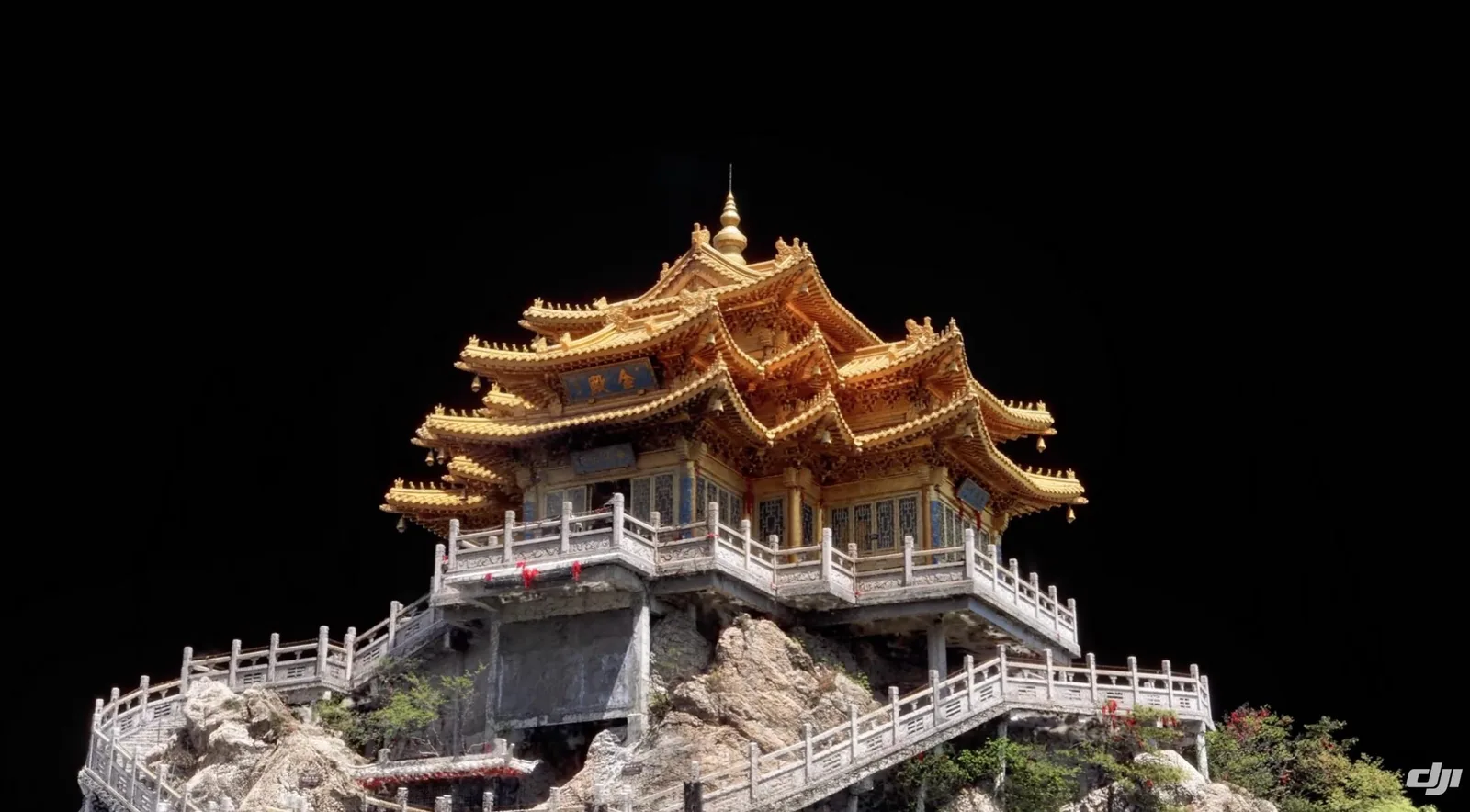 Detailed 3D photogrammetry model of the golden-roofed Wudang Golden Hall temple and its stone balustrades atop a rocky peak, isolated on a black background