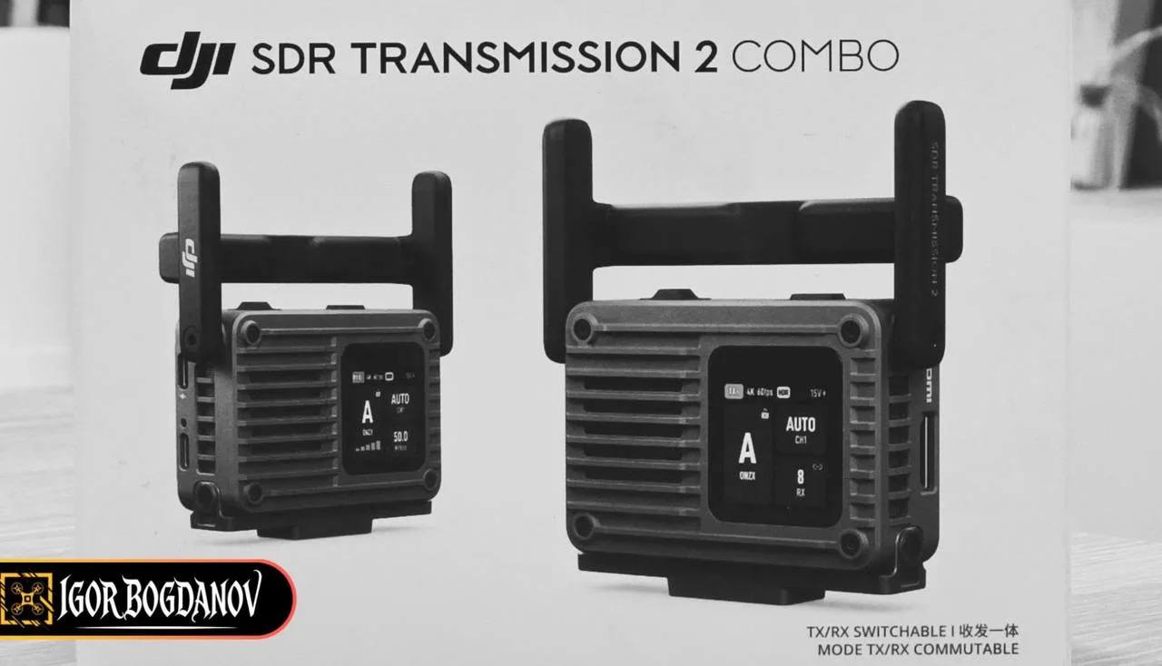 Retail box artwork for the DJI SDR Transmission 2 Combo showing the compact transmitter and larger receiver units with dual antennas and monochrome status displays