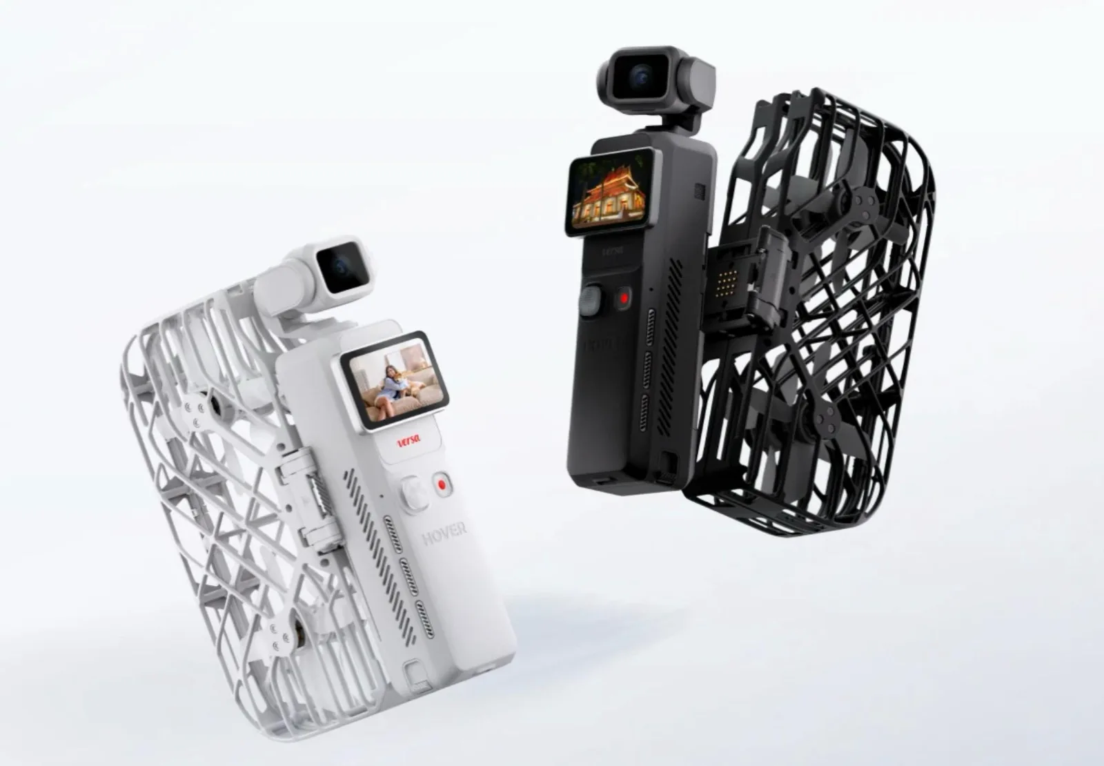 HOVERAir Versa self-flying camera drones in white and black, each with a folding propeller cage and a gimbal-mounted camera above the handheld body