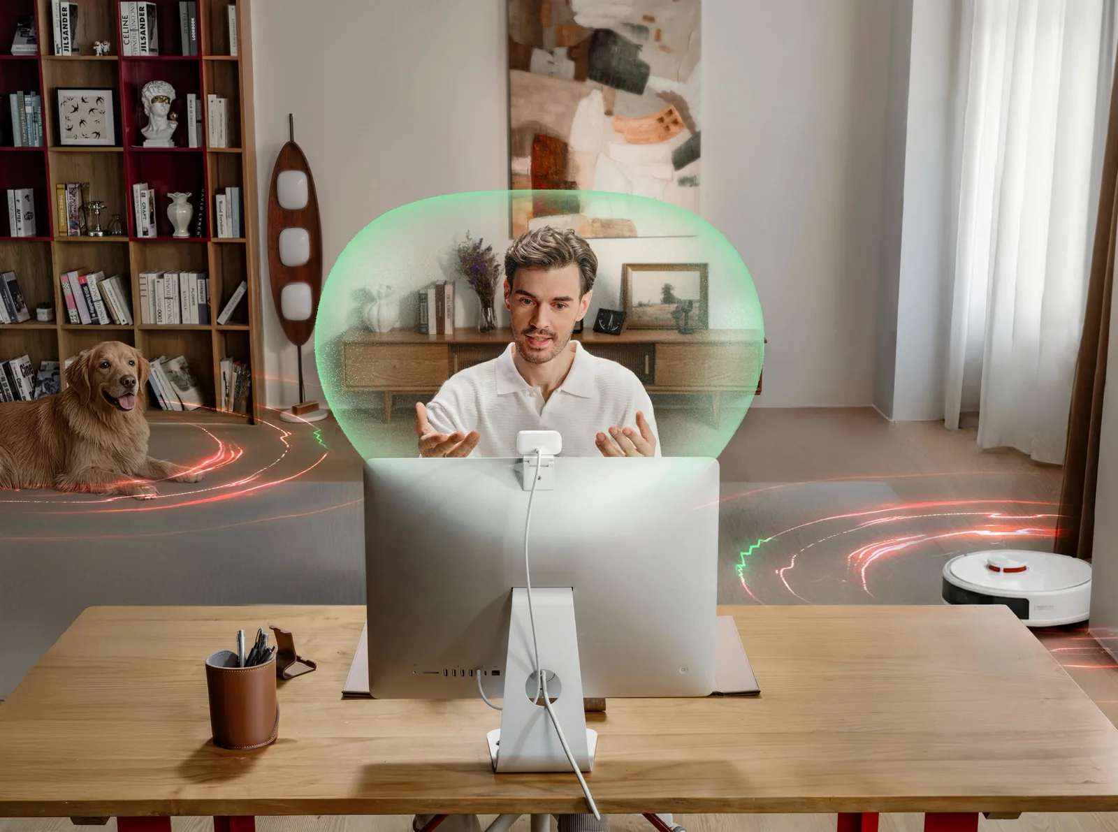 A white Insta360 AI webcam clipped to the top of a desktop monitor tracks a man on a video call in a home office, with a dog and robot vacuum shown outside the framed area.
