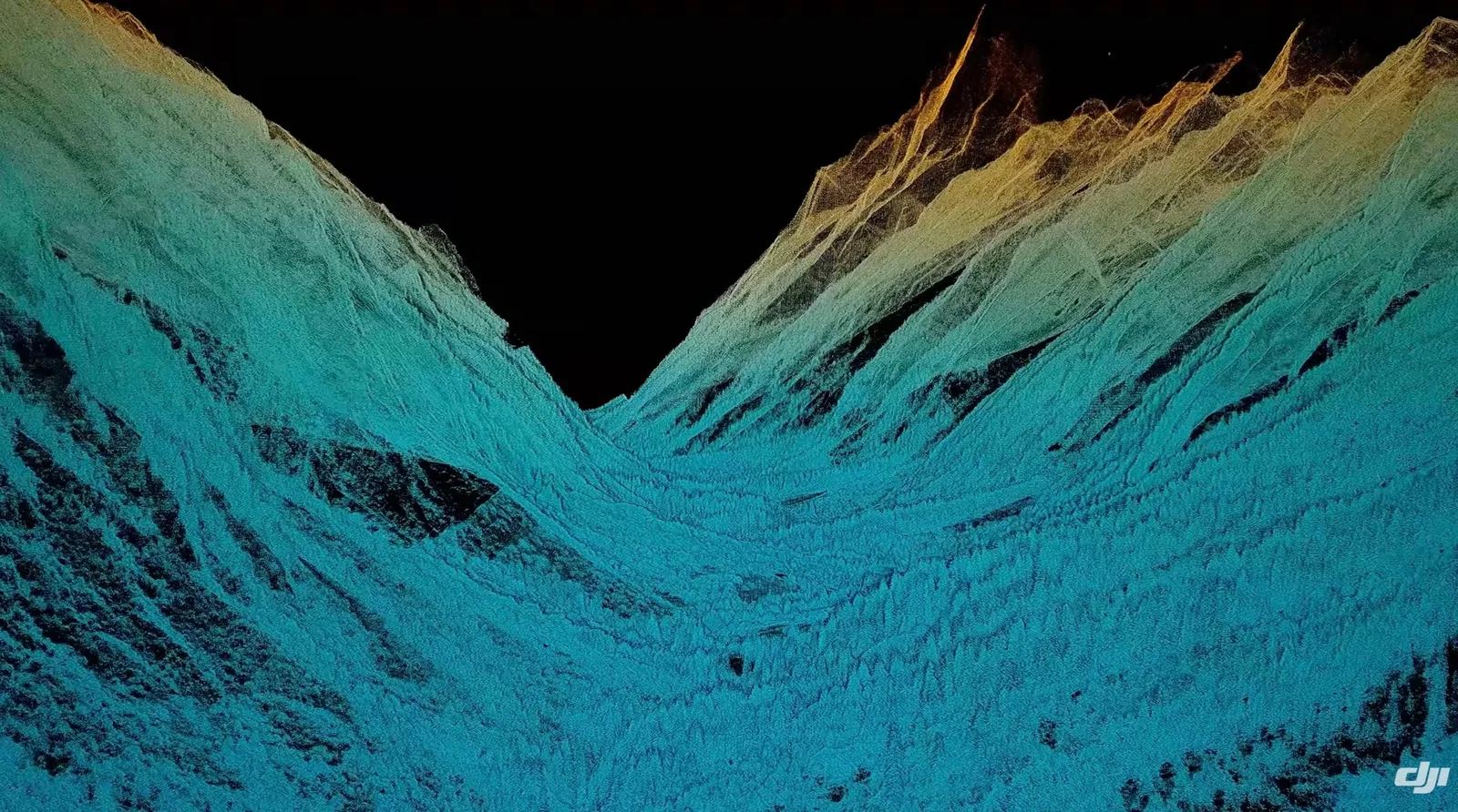 Colorized lidar point cloud of a steep mountain valley, with elevation shown from teal at the valley floor to orange along the ridgeline peaks