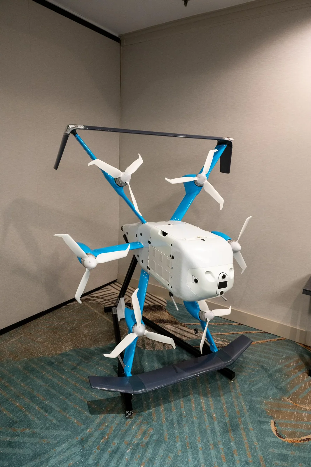 Amazon MK30 delivery drone on a display stand indoors