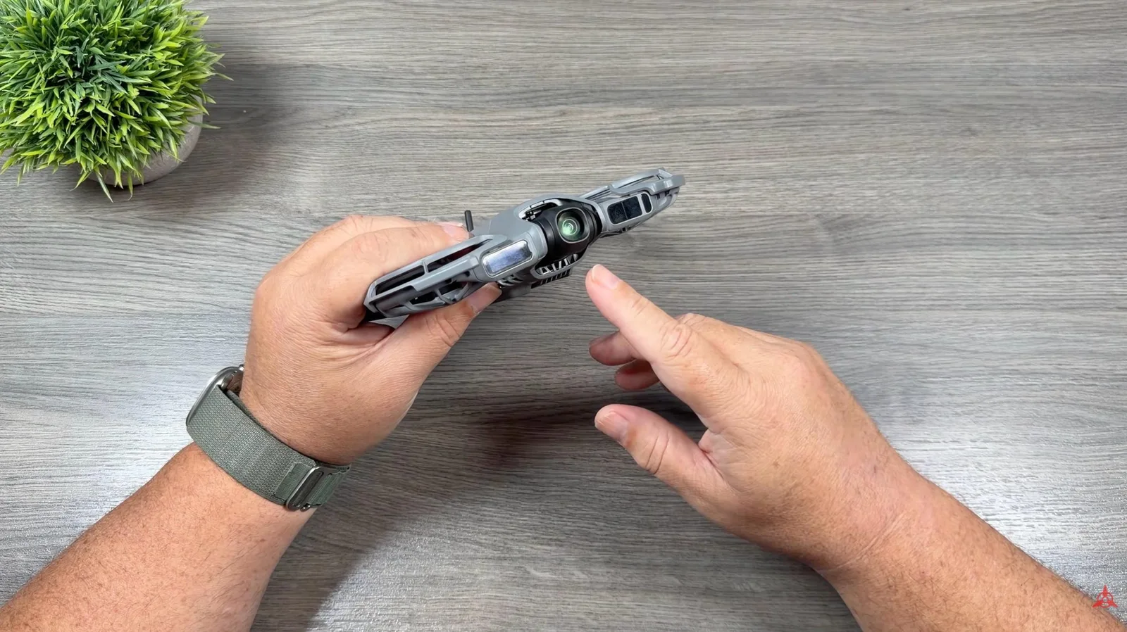 DJI Neo 2 held in one hand, showing how small the drone packs down