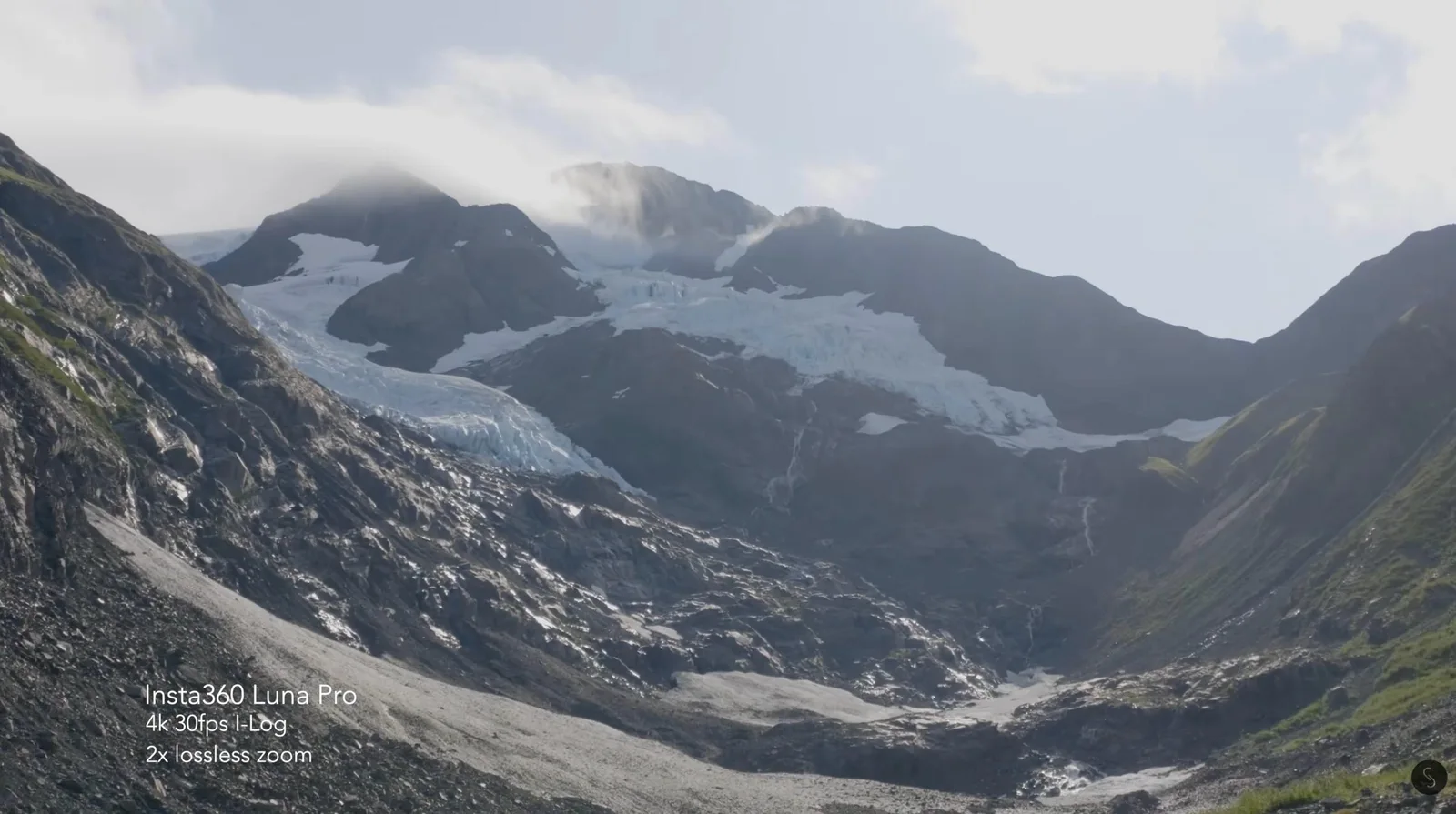 Insta360 Luna Pro aerial view of a glacier winding through a mountain valley