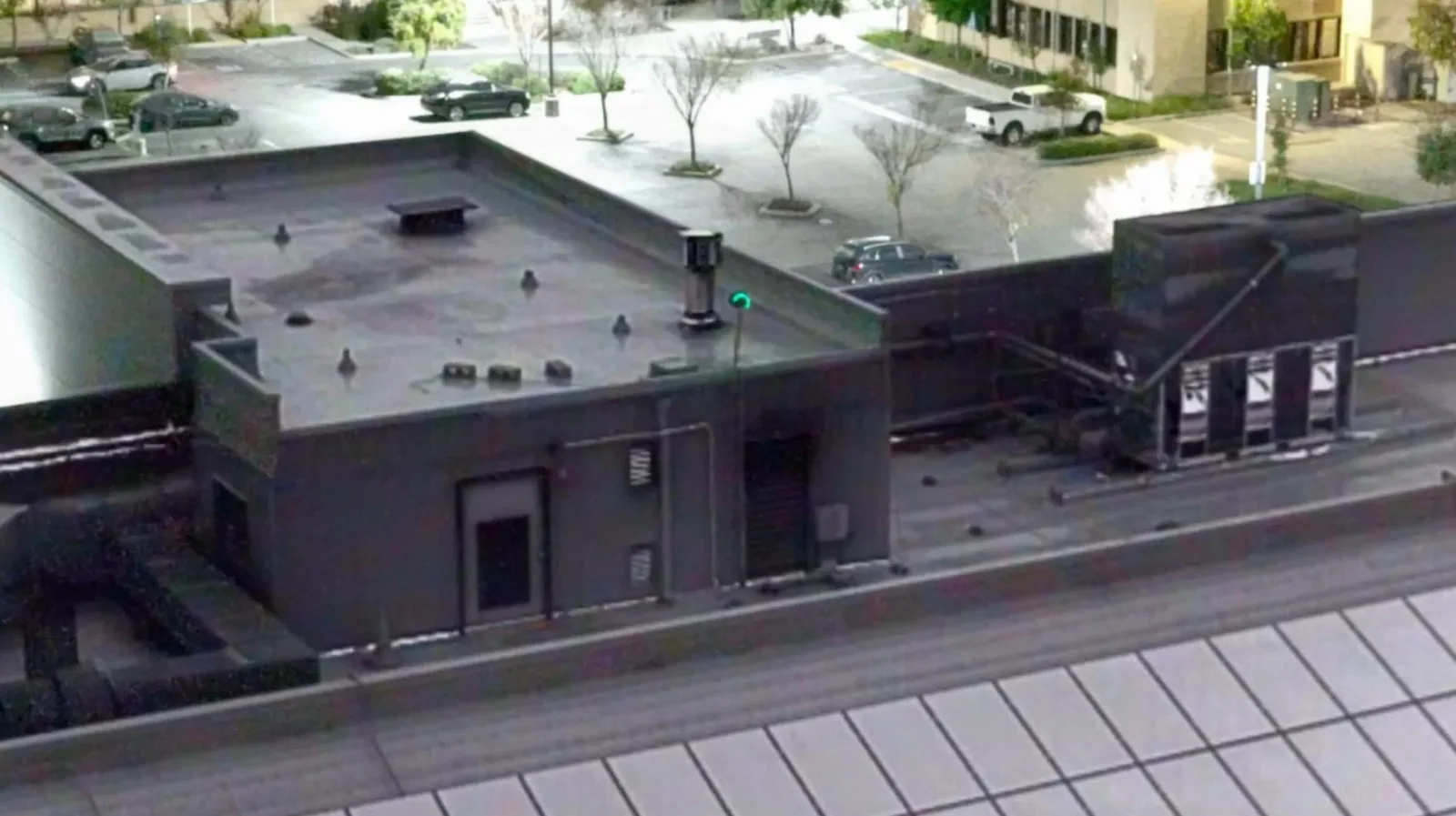 Skydio Thermal Boost demo showing a commercial rooftop in thermal with the surrounding parking lot in the regular camera view