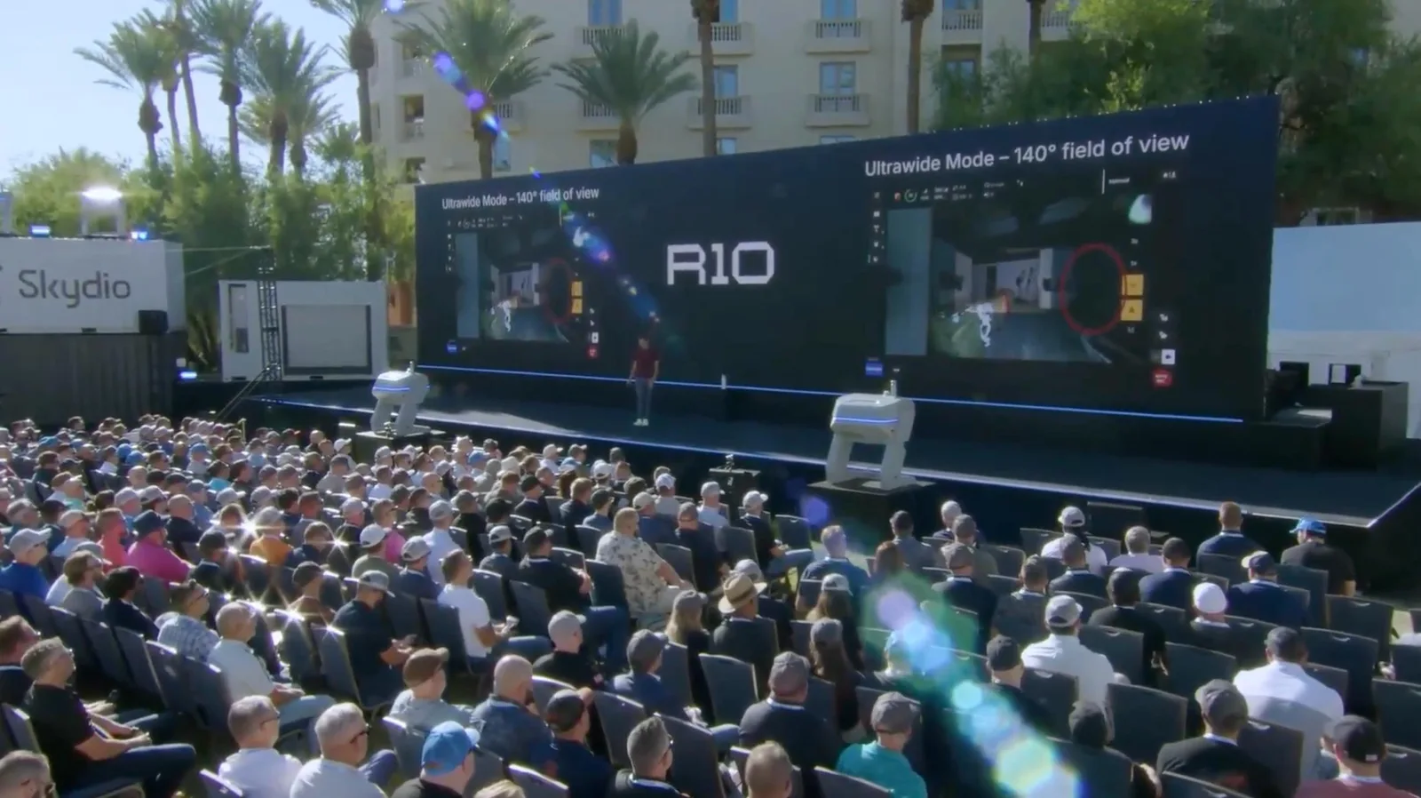 Crowd watches a Skydio presentation on an outdoor stage at Ascend 2026
