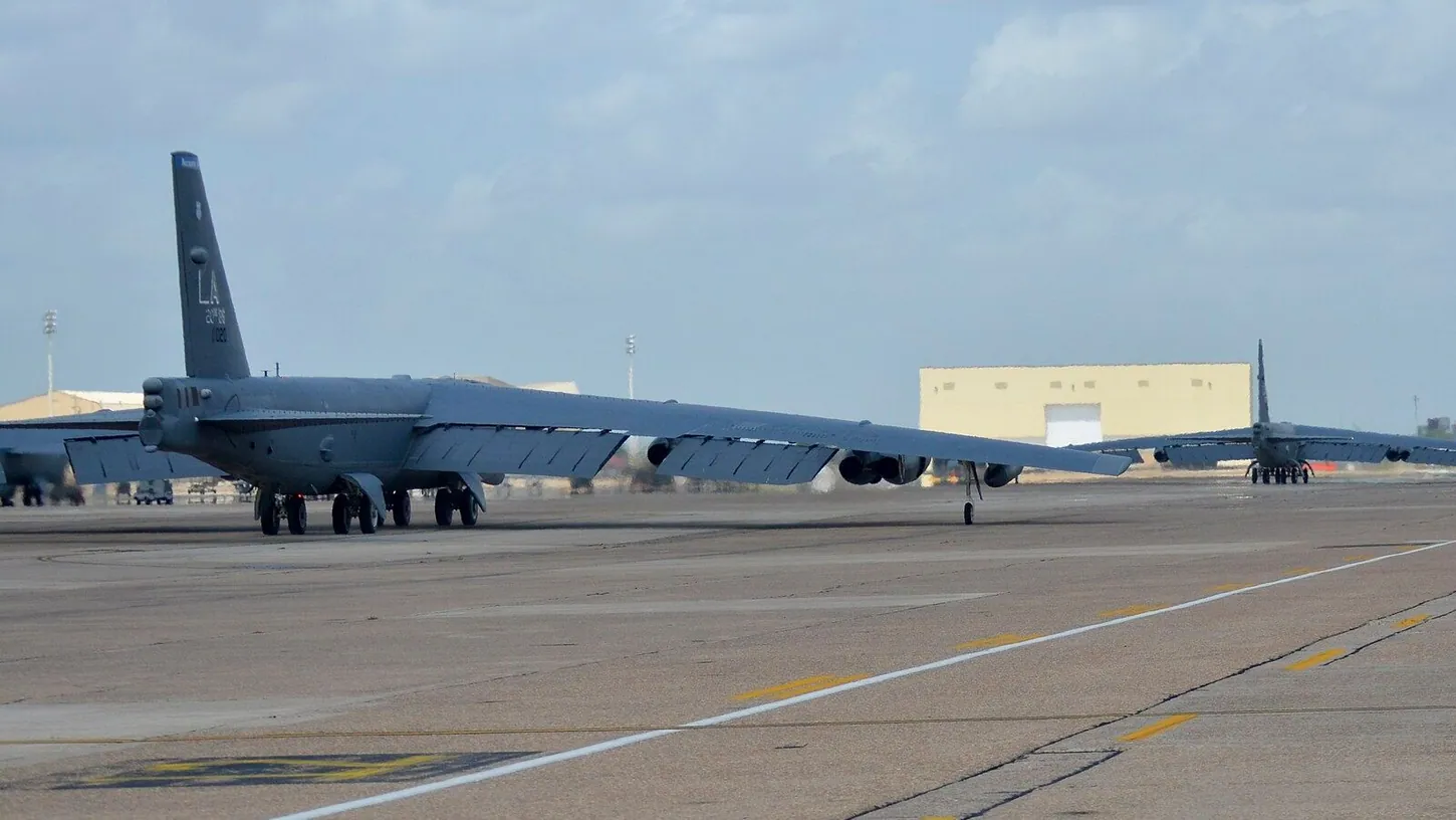 Two B-52H Stratofortress bombers with LA tail codes taxiing on the flight line at Barksdale Air Force Base