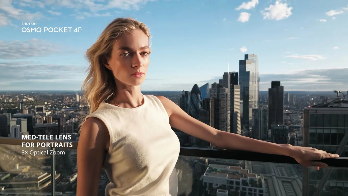 Woman in a sleeveless cream top leaning on a rooftop railing above the London skyline, with the caption Med-Tele Lens For Portraits, 3x Optical Zoom