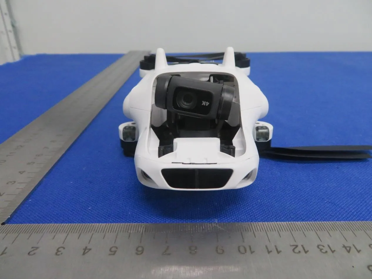 Front view of the white Jovistar drone with its gimbal camera marked 4K, propellers folded, on a blue test mat