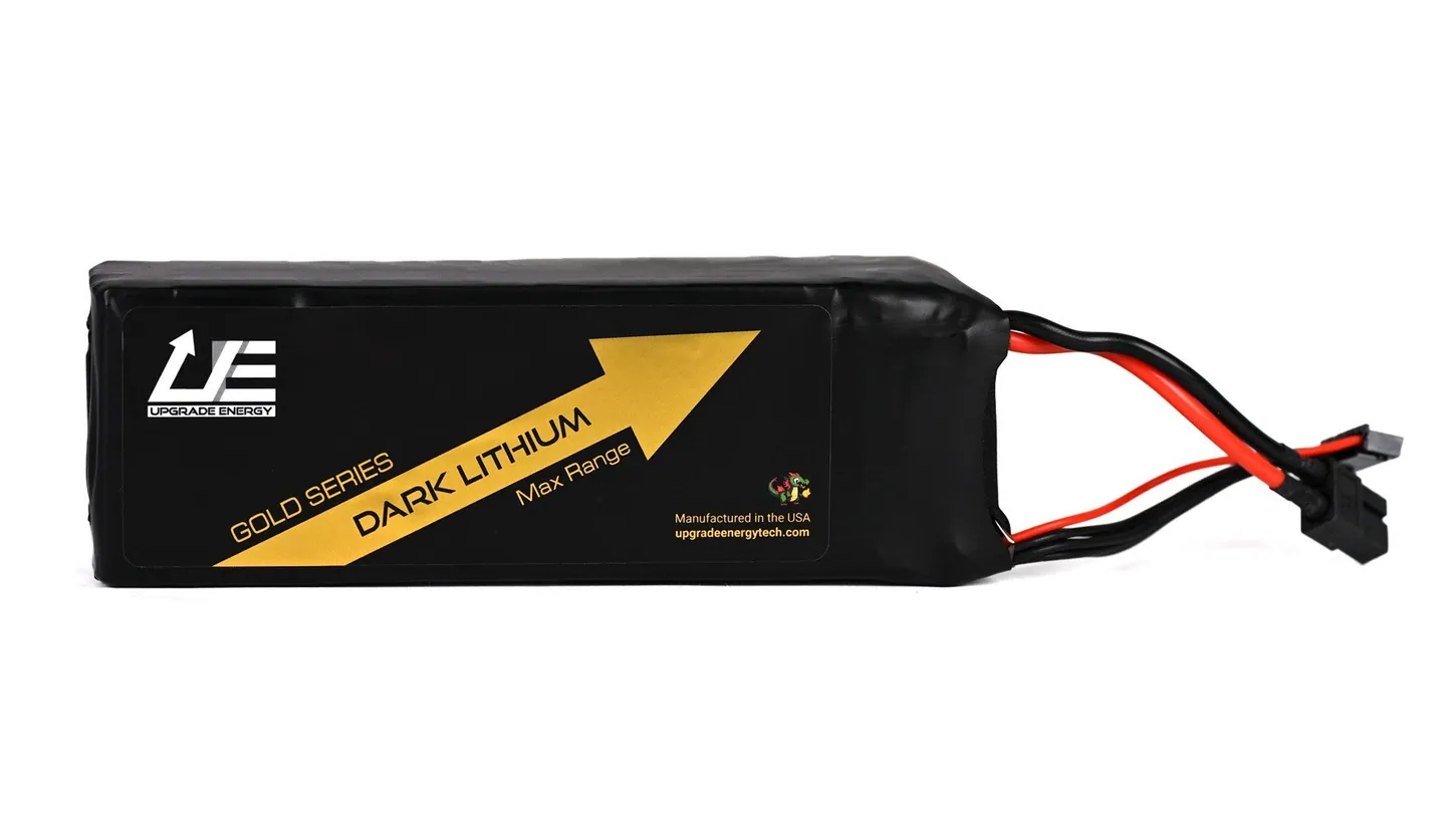 Black Upgrade Energy Dark Lithium Gold Series drone battery pack with a gold arrow label and red and black power leads ending in an XT60 connector